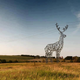 Illustration for article titled These Beautiful Giant Sculptures Support Power Lines With Style